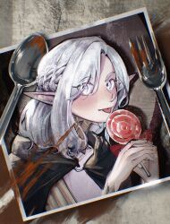 1boy androgynous blood blush candy cloak dungeon_meshi elf euyuyee food fork gorget green_cloak grey_eyes grey_hair half_up_braid highres holding holding_candy holding_food holding_lollipop hood hooded_cloak licking lollipop looking_at_viewer male_focus medium_hair mithrun mithrun_(young) photo_(object) pointy_ears shirt solo spoon tongue tongue_out upper_body wavy_hair