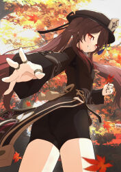 1girl ass black_nails black_shorts brown_hair chinese_clothes coattails from_behind from_below genshin_impact grin hat hat_ornament highres hu_tao_(genshin_impact) konomumu long_hair looking_at_viewer looking_down orange_eyes short_shorts shorts smile solo twintails very_long_hair