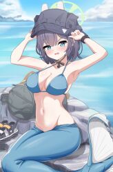Rule 34 | 1girl, absurdres, arms up, backpack, bag, bikini, black headwear, blue archive, blue bikini, blue eyes, blue hair, blush, breasts, commentary request, dark blue hair, day, halo, highres, looking at viewer, medium breasts, medium hair, mermaid costume, monofin, navel, ocean, official alternate costume, outdoors, parted lips, poorunii, rock, saki (blue archive), saki (swimsuit) (blue archive), sitting, solo, stomach, swimsuit, variant set, watch, wristwatch
