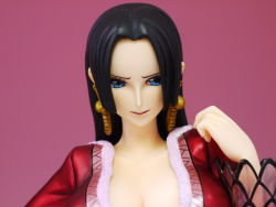Rule 34 | 1girl, amazon lily, black hair, blue eyes, boa hancock, breasts, cleavage, earrings, female focus, figure, jacket, jewelry, one piece, photo (medium), red jacket, simple background, solo
