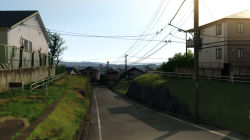 Rule 34 | bad id, bad pixiv id, chain-link fence, day, fence, grass, house, mogumo, mountain, no humans, original, path, photo-referenced, photorealistic, power lines, realistic, road, scenery, sign, sky, tree, utility pole, window