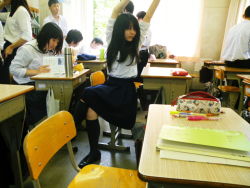 Rule 34 | 3girls, 5boys, arms up, black hair, chair, classroom, curtains, desk, hello kitty, long hair, multiple boys, multiple girls, notebook, o/, outstretched arms, photo (medium), reference photo, sanrio, school, school desk, school uniform, short hair, sitting, skirt, stretching, sunlight, window