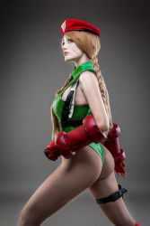 Rule 34 | 1girl, absurdres, argentine (nationality), ass, bare legs, bare shoulders, blonde hair, boots, braid, cammy white, cammy white (cosplay), capcom, cosplay, curvy, fingernails, gloves, green leotard, hat, highleg, highleg leotard, highres, huge ass, leotard, lips, long hair, looking to the side, photo (medium), real life, shiny clothes, simple background, skindentation, solo, sophie valentine, standing, street fighter, street fighter v, thong leotard, twin braids, very long hair, wide hips