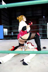Rule 34 | 2girls, arena, ass, blonde hair, boxing ring, breasts, candy cane (rumble roses), candy cane (rumble roses) (cosplay), chouzuki maryou, cleavage, cosplay, fingerless gloves, gloves, highres, huge ass, miss spencer, miss spencer (cosplay), multiple girls, photo (medium), red hair, rumble roses, rumble roses xx, suzuka itsuki