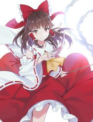 Rule 34 | 1girl, bow, brown eyes, brown hair, collarbone, detached sleeves, floating hair, frilled bow, frilled hair tubes, frills, hair bow, hakurei reimu, holding, lazuri7, long hair, long skirt, long sleeves, looking at viewer, red bow, red ribbon, red shirt, red skirt, ribbon, ribbon-trimmed sleeves, ribbon trim, shirt, skirt, sleeveless, sleeveless shirt, solo, standing, touhou, white background, white sleeves, wide sleeves