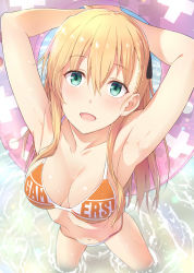 Rule 34 | 1girl, :d, armpits, arms up, bikini, blonde hair, blush, breasts, cleavage, clothes writing, commentary request, foreshortening, from above, gamers!, green eyes, hair between eyes, hair ornament, innertube, kanden sky, long hair, looking at viewer, looking up, medium breasts, navel, open mouth, outdoors, sidelocks, smile, soaking feet, solo, standing, swim ring, swimsuit, tendou karen, wading