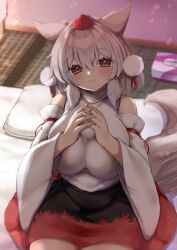Rule 34 | 1girl, alternate breast size, animal ears, bare shoulders, black skirt, blurry, blurry background, breasts, closed mouth, commentary request, detached sleeves, eyes visible through hair, hair between eyes, hands up, hat, head tilt, highres, huge breasts, impossible clothes, impossible shirt, indoors, inubashiri momiji, light blush, looking at viewer, medium hair, medium skirt, multicolored clothes, multicolored skirt, onomiya, own hands together, pillow, pom pom (clothes), red eyes, red skirt, shirt, sitting, skirt, smile, solo, tail, tatami, tissue box, tokin hat, touhou, white hair, white shirt, wolf ears, wolf girl, wolf tail