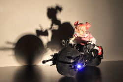 Rule 34 | 10s, 1girl, batman (series), batpod, bow, crossover, dc comics, dress, figure, hair bow, kaname madoka, mahou shoujo madoka magica, mahou shoujo madoka magica (anime), moonshine animations, motor vehicle, motorcycle, photo (medium), pink eyes, pink hair, riding, self-upload, shadow, shoes, silhouette, solo, toy, twintails, vehicle, white legwear