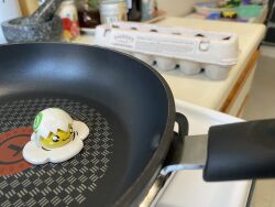 Rule 34 | black eyes, digimon, egg, eggshell, eggshell hat, frying pan, highres, humor, yolkmon