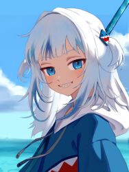 1girl absurdres blue_eyes blue_hair blue_hoodie blue_sky blunt_bangs cloud commentary day drawstring eneeues gawr_gura gawr_gura_(1st_costume) grey_hair grin hair_ornament highres hololive hololive_english hood hoodie long_hair looking_at_viewer multicolored_hair ocean outdoors shark_girl shark_hair_ornament sharp_teeth sky smile solo streaked_hair teeth two_side_up virtual_youtuber