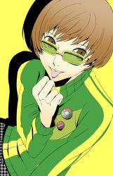 Rule 34 | 1girl, absurdres, badge, brown eyes, brown hair, button badge, green jacket, hareruya (smomo2227), highres, houndstooth, jacket, light brown hair, persona, persona 4, reverse trap, satonaka chie, short hair, simple background, solo, tomboy, tongue, tongue out, track jacket, yellow-framed eyewear, yellow background