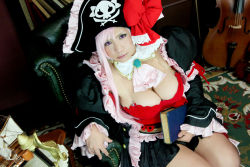 Rule 34 | 1girl, book, breasts, captain liliana, captain liliana (cosplay), chouzuki maryou, cosplay, hat, large breasts, photo (medium), pink hair, pirate, pirate hat, plump, purple eyes, queen&#039;s blade, queen&#039;s blade rebellion
