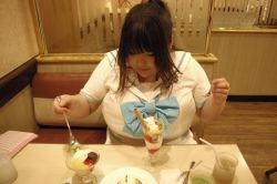 Rule 34 | 1girl, asian, black hair, bow, breasts, cosplay, eating, fat, fruit, huge breasts, itou yukino, itou yukino (cosplay), kiwi (fruit), luu (cosplayer), photo (medium), real drive, solo