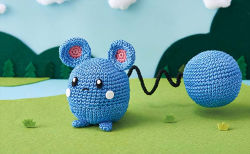 Rule 34 | amigurumi (medium), asako ito, azurill, blue sky, commentary, creature, creatures (company), day, english commentary, frown, full body, game freak, gen 3 pokemon, grass, nintendo, no humans, official art, outdoors, photo (medium), pokemon, pokemon (creature), pokemon tcg, sky, solo, standing, third-party source, tree, unconventional media