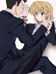 2boys adanami_hato androgynous black_jacket black_pants blonde_hair blush brown_hair chain earrings formal_clothes highres hunter_x_hunter jacket jewelry kurapika leorio_paladiknight long_sleeves looking_at_another male_focus multiple_boys pants pointing ring round_eyewear shirt short_hair simple_background sitting suit sweatdrop upper_body white_background white_shirt yaoi