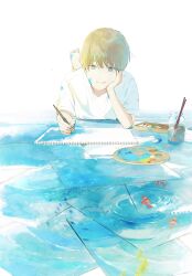 Rule 34 | 1boy, barefoot, blue eyes, brown hair, closed mouth, drawing, fish, hand on own cheek, hand on own face, highres, holding, holding brush, light smile, lying, on stomach, original, paintbrush, painting (object), paper, patting, picture frame, shirt, short hair, short sleeves, smile, solo, water, white shirt, yuribou