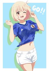 Rule 34 | 1girl, 2022 fifa world cup, :d, ;d, blonde hair, blue shirt, border, breasts, collarbone, cowboy shot, dars (recolors), green background, hands up, highres, japanese flag, large breasts, lycoris recoil, midriff, navel, nishikigi chisato, one eye closed, open mouth, ribbon, shirt, short sleeves, shorts, smile, soccer uniform, sportswear, teeth, upper teeth only, white border, white shorts, world cup