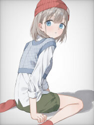 Rule 34 | 1girl, :o, aqua eyes, beanie, commentary request, cropped vest, green shorts, grey hair, hat, highres, idolmaster, idolmaster shiny colors, looking at viewer, looking back, red hat, red socks, serizawa asahi, shadow, shirt, short hair, shorts, simple background, sitting, socks, solo, vest, wariza, white shirt, yumeme 818