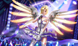 Rule 34 | 1girl, alternate costume, blonde hair, breasts, cleavage, confetti, crowd, glowstick, hair over one eye, heart, idol, liang xing, looking at viewer, mechanical wings, mercy (overwatch), overwatch, overwatch 1, solo, stage, thighhighs, wings