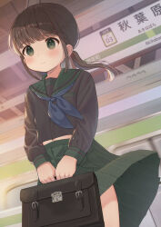 1girl bag black_bag black_hair black_serafuku blue_neckerchief blunt_bangs blush breast_pocket closed_mouth clothes_lift cowboy_shot dot_nose flat_chest floating_hair green_eyes green_sailor_collar green_skirt holding holding_bag light_smile long_hair long_sleeves looking_ahead low_twintails midriff mimikaki_(men_bow) navel neckerchief original outdoors pleated_skirt pocket sailor_collar school_bag school_uniform serafuku sidelocks skirt skirt_lift solo standing subway subway_station twintails wind wind_lift