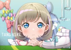 Rule 34 | 1girl, absurdres, blue bow, blue eyes, blush, bob cut, bow, brown hair, character name, closed mouth, commentary, expressionless, eyebrows hidden by hair, flipped hair, hair bow, happy birthday, high tops, highres, light brown hair, light frown, looking at viewer, love live!, love live! superstar!!, medium hair, on table, panda copt, portrait, sneakers, solo, table, tang keke