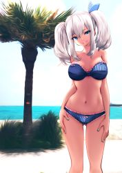 Rule 34 | 10s, 1girl, beach, bikini, blue bikini, blue eyes, breasts, cowboy shot, green nails, head tilt, highres, kantai collection, kashima (kancolle), large breasts, lawson, looking at viewer, nail polish, ocean, outdoors, silver hair, sky, smile, solo, souryu, standing, strapless, strapless bikini, swimsuit, twintails