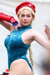 Rule 34 | 1girl, ass, bare legs, bare shoulders, blonde hair, braid, breasts, cammy white, cammy white (cosplay), cosplay, curvy, earrings, fighting stance, fingerless gloves, gloves, hat, highleg, highleg leotard, italian (nationality), jewelry, large breasts, leotard, lips, long hair, photo (medium), real life, revealing clothes, skindentation, sleeveless, smile, standing, street fighter, thong leotard, twin braids, very long hair, wide hips, yuriko tiger