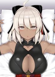 Rule 34 | 1girl, ahoge, arms up, bare shoulders, black bow, bow, breasts, cleavage, cleavage cutout, clothing cutout, commentary request, dark-skinned female, dark skin, eyes visible through hair, fate/grand order, fate (series), hair bow, indoors, large breasts, looking at viewer, lying, mitsukazu (nijigen complex), okita souji (fate), okita souji alter (fate), okita souji alter (first ascension) (fate), on back, on bed, open mouth, pillow, pillow grab, sleeveless, solo, upper body, white hair, yellow eyes