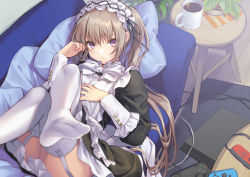 1girl, apron, bangs, black dress, bow, bowtie, controller, couch, cup, dress, expressionless, feet, frilled apron, frilled cuffs, frills, from above, game console, game controller, garter straps, hand on own chest, hands up, indoors, knees up, legs crossed, long hair, looking at viewer, lying, maid, maid headdress, mug, ne-on, no shoes, on back, on couch, original, pillow, playstation 4, purple eyes, rug, sidelocks, soles, solo, thighhighs, twintails, white legwear, wooden floor