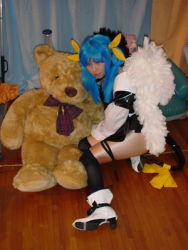 Rule 34 | 1girl, arc system works, asymmetrical wings, blue hair, cosplay, cosplay photo, dizzy (guilty gear), guilty gear, lowres, pantyhose, photo (medium), ribbon, solo, tail, tail ornament, tail ribbon, wings