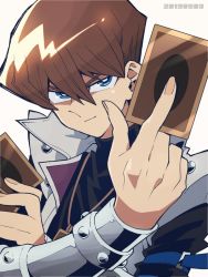 Rule 34 | 1boy, black shirt, blue eyes, brown hair, card, card pendant, coat, dated, enotou (enotou moi), hair between eyes, holding, jewelry, kaiba seto, male focus, pendant, shirt, simple background, smile, solo, upper body, white background, yu-gi-oh!, yu-gi-oh! duel monsters