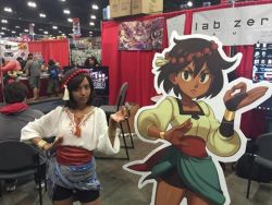 Rule 34 | 1girl, ajna (indivisible), ankle wrap, artist request, beads, bike shorts, bracelet, breasts, bridal gauntlets, brown eyes, brown hair, cosplay, dark skin, hair beads, hair ornament, indivisible, jewelry, lab zero games, lowres, real life, sash, short hair, shorts, shorts under skirt, skirt, source request