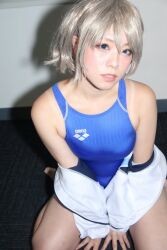 Rule 34 | 510ra kmgr, arena (company), blue eyes, competition swimsuit, cosplay, cosplay photo, grey hair, kneeling, looking at viewer, looking up, love live!, love live! sunshine!!, one-piece swimsuit, photo (medium), short hair, swimsuit, watanabe you