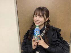 Rule 34 | 1girl, aida rikako, bottle, indoors, long hair, looking at viewer, photo (medium), smile, standing, twintails, voice actor