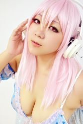 Rule 34 | 1girl, asian, cosplay, headphones, nitroplus, photo (medium), pink hair, plump, solo, super sonico, super sonico (cosplay), wakamu