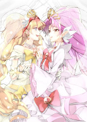 Rule 34 | 2girls, akagi towa, amanogawa kirara, bow, brooch, brown hair, cowboy shot, cure scarlet, cure scarlet (dress up premium), cure twinkle, cure twinkle (dress up premium), dress, earrings, eye contact, go! princess precure, hareta, holding hands, jewelry, long hair, looking at another, low-tied long hair, magical girl, mode elegant (go! princess precure), multicolored hair, multiple girls, necklace, pink hair, pointy ears, precure, purple eyes, red bow, red eyes, red hair, ring, seita, smile, streaked hair, tiara, two-tone hair, veil, white background, yellow bow, yuri