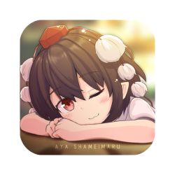 Rule 34 | 1girl, ;3, arm rest, black hair, blurry, blurry background, blush, brown eyes, character name, commentary request, eyelashes, hat, head rest, light blush, looking at viewer, one eye closed, pointy ears, pom pom (clothes), saisoku no yukkuri, shameimaru aya, shirt, short hair, short sleeves, solo, tokin hat, touhou, transparent background, two-tone background, upper body, white shirt
