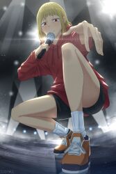Rule 34 | 1girl, black shorts, blonde hair, chainsaw man, glint, highres, holding, holding microphone, hood, hoodie, looking at viewer, medium hair, microphone, rappa, red eyes, red hoodie, sawatari akane (chainsaw man), shoes, shorts, sidelocks, slit pupils, sneakers, socks, solo, spotlight, squatting, stage lights