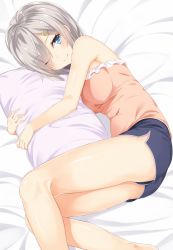 Rule 34 | 10s, 1girl, bad id, bad twitter id, bare arms, bare shoulders, bed, bed sheet, blue eyes, blue shorts, breasts, eyes visible through hair, hair ornament, hair over one eye, hairclip, hamakaze (kancolle), highres, kantai collection, light smile, looking at viewer, lying, hugging object, on side, one eye closed, pillow, pillow hug, pink shirt, shirt, short hair, shorts, solo, takehana note, tank top, thighs