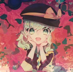 Rule 34 | 1girl, :d, black hat, blush, bow, commentary request, floral background, flower, frilled sleeves, frills, gem, green eyes, green hair, hand on own cheek, hand on own face, hands on own face, hat, hat bow, hat ribbon, heart, komeiji koishi, long sleeves, looking at viewer, multicolored eyes, open mouth, orange bow, pink flower, ribbon, smile, solo, tareme, third eye, touhou, tsukikusa, upper body, wavy hair, wide sleeves, yellow bow