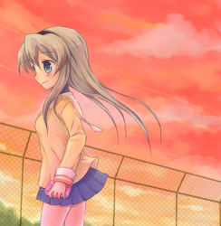 Rule 34 | 00s, 1girl, black hairband, blue eyes, blue skirt, blush, box, breasts, brown hair, chain-link fence, clannad, closed mouth, cloud, contrail, cowboy shot, evening, fence, gift, gift box, hairband, holding, holding gift, long hair, long sleeves, looking afar, miniskirt, outdoors, pleated skirt, sakagami tomoyo, school uniform, serafuku, skirt, sky, small breasts, smile, solo, standing, tareme