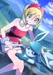 Rule 34 | 1girl, absurdres, blonde hair, blue eyes, blush, closed mouth, cloud, collar, collarbone, commentary request, creatures (company), day, eyelashes, game freak, gen 4 pokemon, glaceon, grass, hairband, highres, holding, irida (pokemon), jewelry, knees, knees together feet apart, neck ring, nintendo, outdoors, pokemon, pokemon (creature), pokemon legends: arceus, pon yui, red hairband, red shirt, rock, sash, shiny skin, shirt, short hair, shorts, sitting, sky, strapless, strapless shirt, white shorts