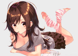 Rule 34 | 1girl, antenna hair, black skirt, book, breasts, brown eyes, brown hair, cleavage, closed mouth, crossed arms, feet, food, food in mouth, grey background, grey shirt, holding, holding book, leg warmers, long hair, looking at viewer, loungewear, lying, medium breasts, mouth hold, no shoes, off shoulder, on stomach, open book, original, pocky, shirt, simple background, skirt, soles, solo, sushikuugo (suisen), swept bangs, the pose, toeless legwear, toes, wavy hair