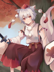 Rule 34 | 1girl, absurdres, animal ears, breasts, closed mouth, detached sleeves, hakama, hakama pants, hat, highres, holding, holding shield, holding sword, holding weapon, in tree, inubashiri momiji, japanese clothes, koizumo, light smile, long sleeves, looking at viewer, pants, pom pom (clothes), red eyes, ribbon-trimmed sleeves, ribbon trim, sarashi, shield, short hair, sitting, sitting in tree, solo, sword, tail, tokin hat, touhou, tree, turtleneck, weapon, white hair, wide sleeves, wolf ears, wolf tail
