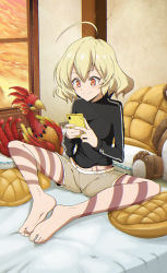 Rule 34 | 10s, 1girl, :3, ahoge, akuma no riddle, barefoot, bed, blonde hair, blush, breasts, cellphone, draw-till-death, feet, feet together, hashiri nio, highres, knees apart feet together, phone, red eyes, short hair, shorts, sitting, smile, solo, stuffed toy, tattoo, toes