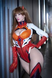 Rule 34 | 1girl, adapted costume, argentine (nationality), bodysuit, breasts, brown hair, cleavage, cleavage cutout, clothing cutout, cosplay, curvy, evangelion: 3.0 you can (not) redo, hand on own hip, highleg, highleg leotard, highres, leotard, lips, long hair, looking at viewer, medium breasts, neon genesis evangelion, official alternate costume, photo (medium), plugsuit, rebuild of evangelion, red leotard, shiny clothes, simple background, skin tight, skindentation, smile, solo, sophie valentine, souryuu asuka langley, souryuu asuka langley (cosplay), standing, thighhighs, thong leotard, wall, wide hips