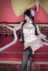 Rule 34 | 1girl, asian, bare shoulders, black hair, black thighhighs, bun cover, china dress, chinese clothes, color contacts, cosplay, crossed legs, date a live, double bun, dress, feather boa, hair bun, hair over one eye, indoors, lace, lace-trimmed legwear, lace trim, long hair, looking at viewer, makeup, mascara, parted lips, photo (medium), red eyes, short china dress, sitting, sleeveless, sleeveless dress, solo, thighhighs, tokisaki kurumi, tokisaki kurumi (cosplay), twintails, zettai ryouiki