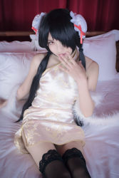 Rule 34 | 1girl, artist request, asian, bare shoulders, bed, bedroom, black hair, black thighhighs, blurry, bun cover, china dress, chinese clothes, color contacts, cosplay, date a live, depth of field, double bun, dress, feather boa, hair bun, hair over one eye, halter dress, halterneck, indoors, lace, lace-trimmed legwear, lace trim, long hair, looking at viewer, makeup, mascara, on bed, parted lips, photo (medium), pillow, red eyes, short china dress, sitting, sleeveless, sleeveless dress, solo, thighhighs, tokisaki kurumi, tokisaki kurumi (cosplay), twintails, zettai ryouiki