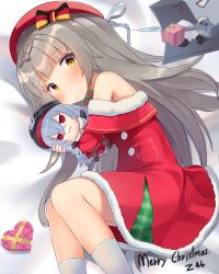 Rule 34 | alternate costume, azur lane, bare shoulders, beret, blunt bangs, bow, box, character doll, character name, christmas, commentary, dress, fur-trimmed dress, fur trim, gift, gift box, graf zeppelin (azur lane), grey hair, hair bow, hair ribbon, hat, heart-shaped box, highres, long hair, looking at viewer, lying, merry christmas, mole, mole under eye, hugging object, on side, ribbon, santa costume, sidelocks, socks, solo, touch (thutchai), white socks, yellow eyes, z46 (azur lane)