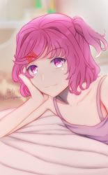 Rule 34 | 1girl, bed, bed sheet, closed mouth, doki doki literature club, elbow rest, hair ornament, hairclip, hand on own cheek, hand on own face, head on hand, head rest, highres, leguma, looking at viewer, natsuki (doki doki literature club), pink eyes, pink hair, pink tank top, short hair, short twintails, smile, solo, tank top, twintails